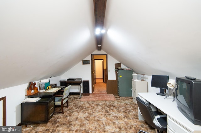 carpeted office featuring vaulted ceiling with beams