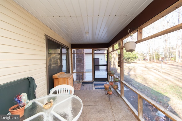 sunroom / solarium featuring wooden ceiling