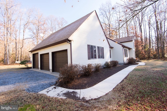 view of side of property with a garage