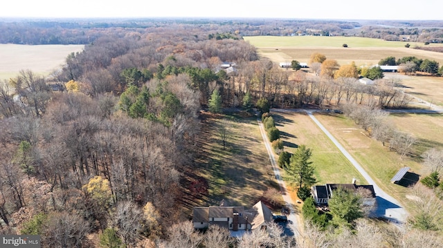 birds eye view of property with a rural view