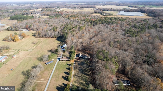 birds eye view of property with a rural view