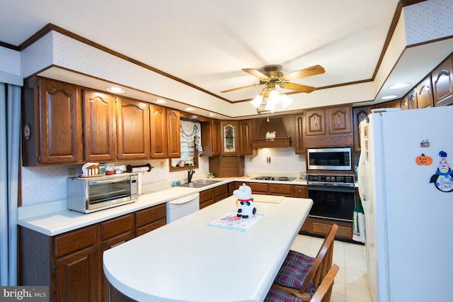 kitchen featuring white appliances, premium range hood, sink, ornamental molding, and a kitchen bar