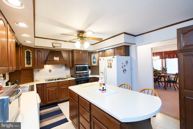 kitchen with stainless steel microwave, white fridge with ice dispenser, premium range hood, oven, and ornamental molding