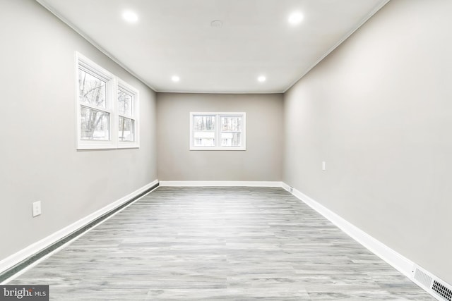 unfurnished room featuring light wood-type flooring