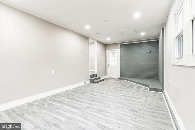 spare room with light hardwood / wood-style floors