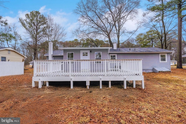 rear view of house with a wooden deck