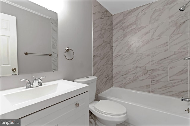 full bathroom with vanity, tiled shower / bath combo, and toilet