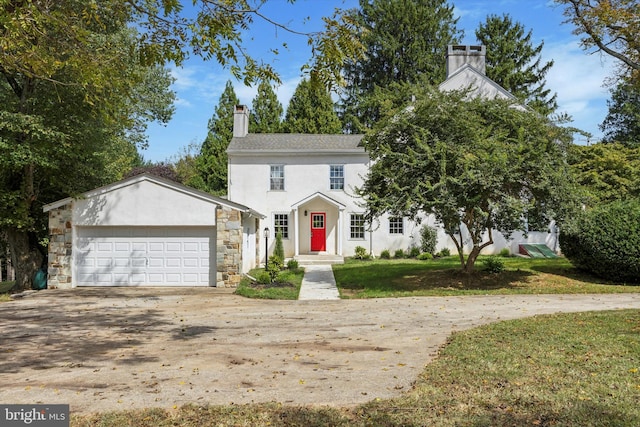 view of front of house featuring a front yard and a garage