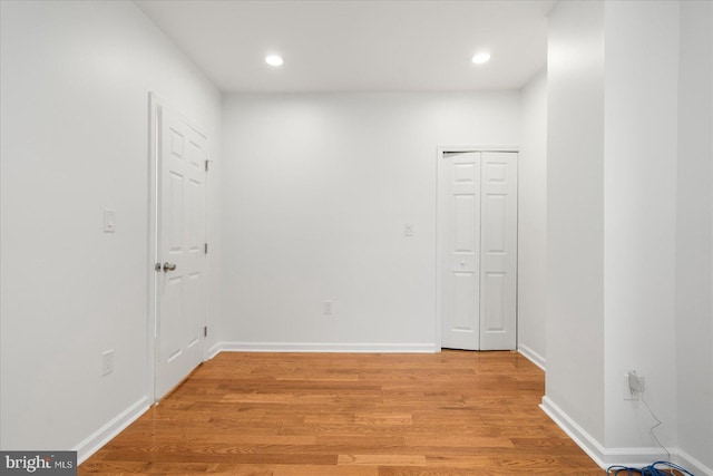 spare room featuring light hardwood / wood-style flooring