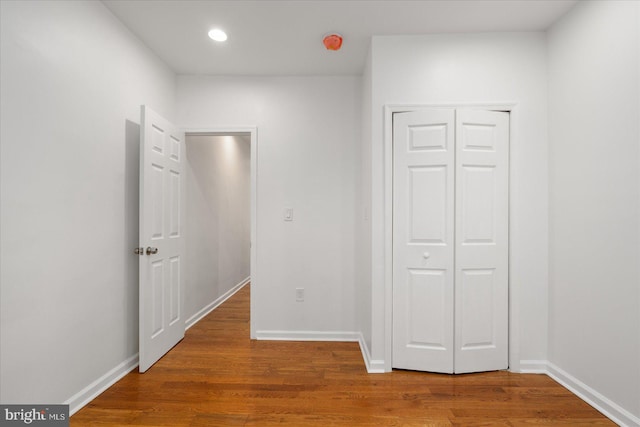 hallway featuring wood-type flooring