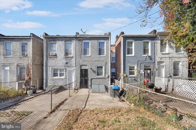 view of property with a patio and cooling unit