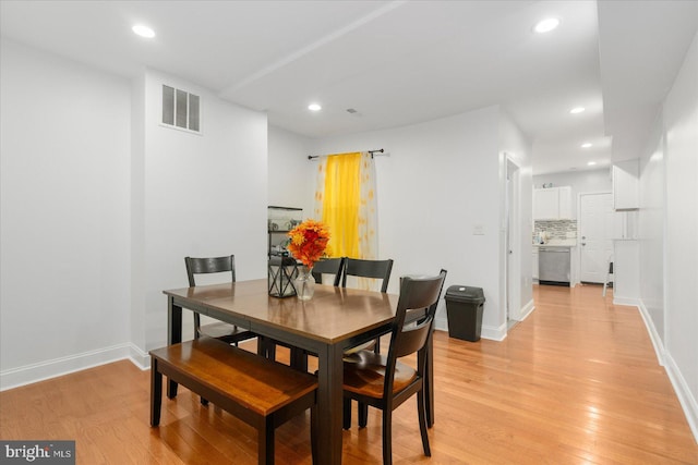 dining room featuring light hardwood / wood-style flooring