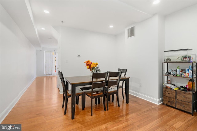 dining space featuring light wood-type flooring