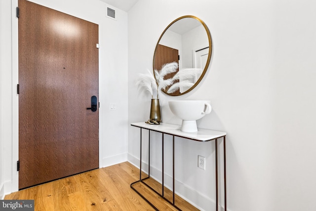 foyer with light hardwood / wood-style floors