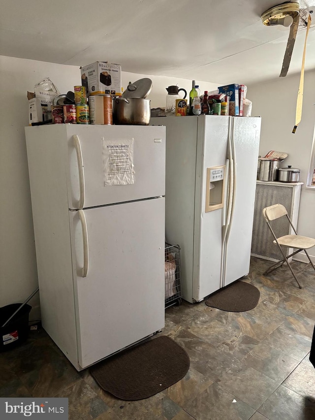 kitchen with white fridge and white refrigerator with ice dispenser