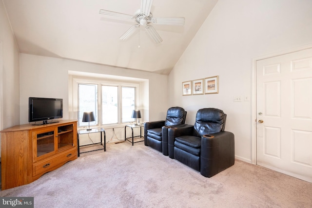 carpeted living room with high vaulted ceiling and ceiling fan