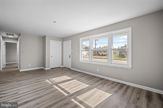 spare room with hardwood / wood-style flooring