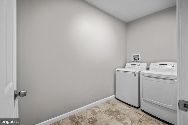 laundry room with washing machine and clothes dryer