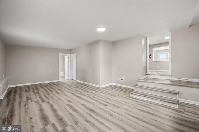 spare room featuring light wood-type flooring