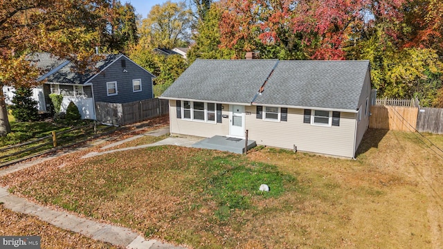 back of house with a yard