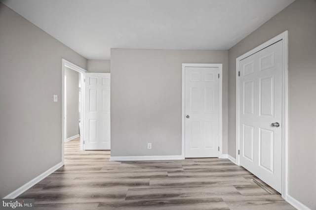 unfurnished bedroom featuring light hardwood / wood-style floors