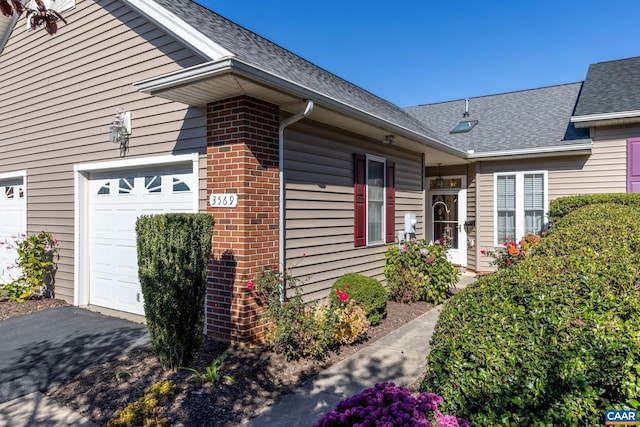 property entrance with a garage