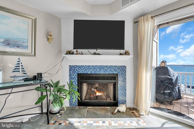 details featuring a tile fireplace