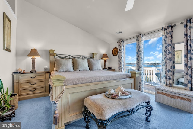 bedroom featuring ceiling fan, carpet flooring, and lofted ceiling