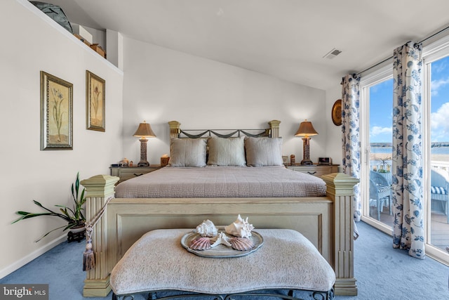 bedroom featuring access to outside, vaulted ceiling, and carpet floors