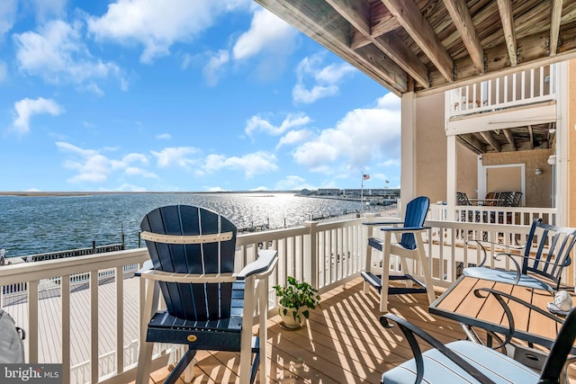 balcony featuring a water view