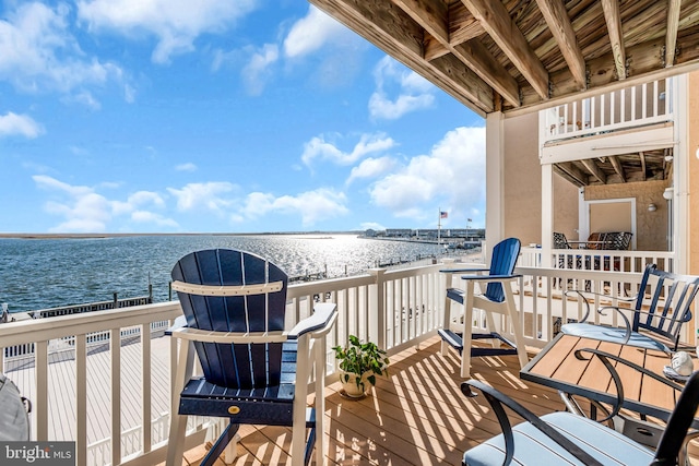 balcony with a beach view and a water view