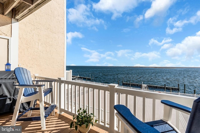 balcony featuring a water view