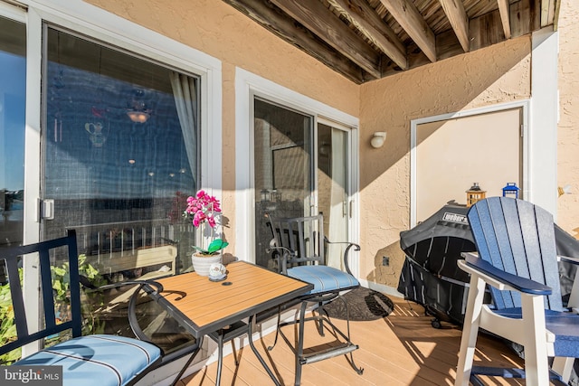 wooden balcony featuring a deck