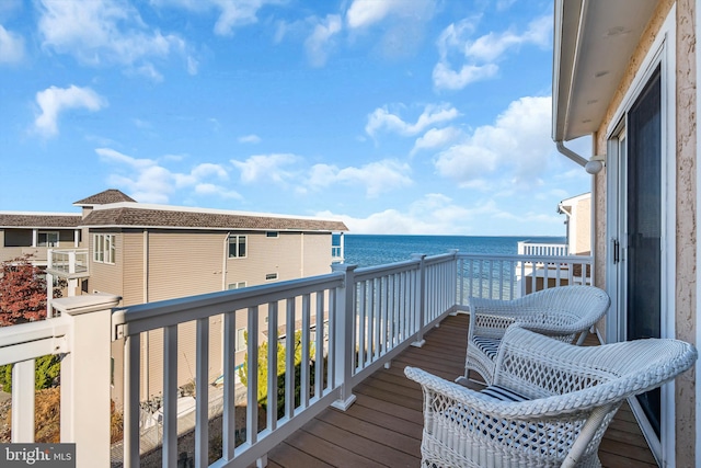 balcony featuring a water view