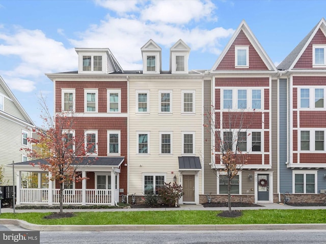 multi unit property featuring a porch