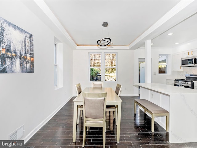 2592 Druid Park Dr, Baltimore, MD 21215 - dining area with baseboards, ornamental molding, a tray ceiling, recessed lighting, and dark wood finished floors