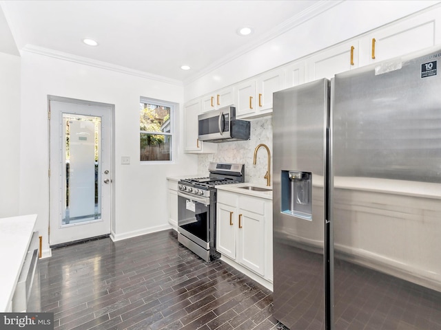 2592 Druid Park Dr, Baltimore, MD 21215 - kitchen with stainless steel appliances, a sink, light countertops, backsplash, and white cabinetry