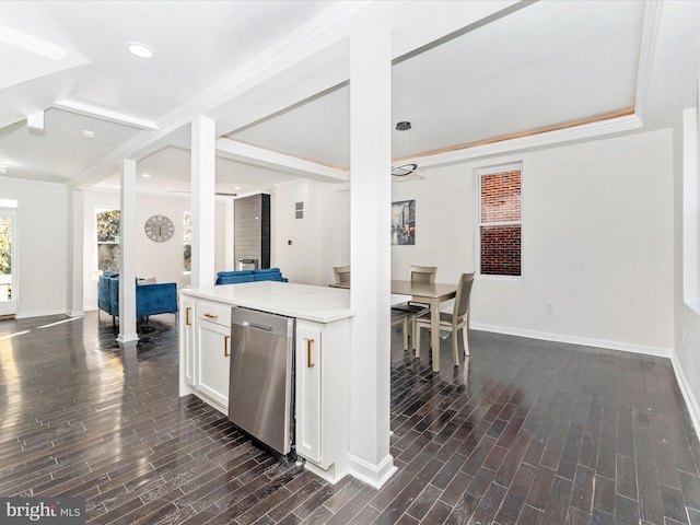 kitchen with stainless steel fridge, dark hardwood / wood-style flooring, white cabinetry, and ornamental molding