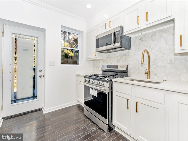 2592 Druid Park Dr, Baltimore, MD 21215 - kitchen featuring stainless steel appliances, a sink, ornamental molding, backsplash, and baseboards