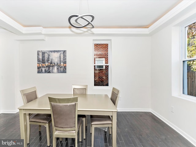 dining area featuring crown molding and dark hardwood / wood-style flooring