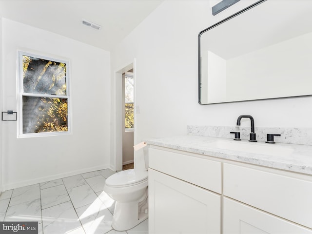2592 Druid Park Dr, Baltimore, MD 21215 - bathroom featuring marble finish floors, toilet, vanity, and baseboards