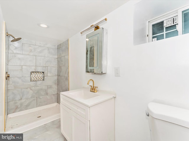 2592 Druid Park Dr, Baltimore, MD 21215 - full bath with toilet, tiled shower, vanity, recessed lighting, and marble look tiles