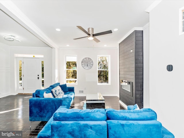 living room featuring ceiling fan, dark hardwood / wood-style floors, and ornamental molding