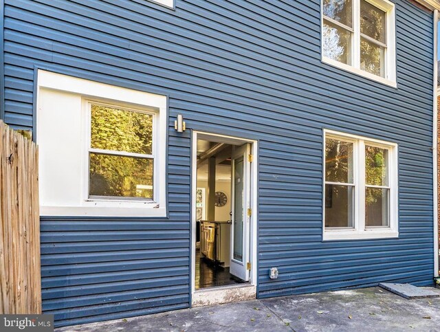 doorway to property with a patio area