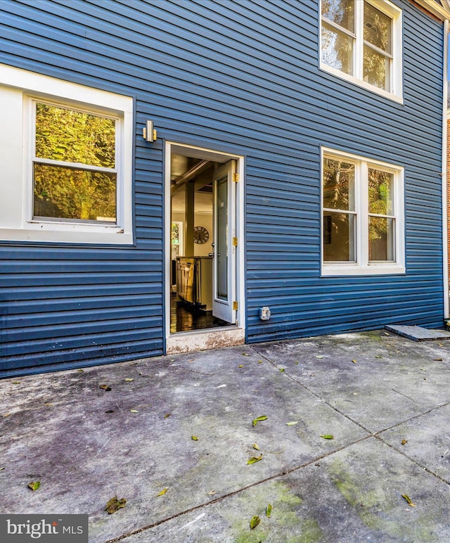 doorway to property featuring a patio area