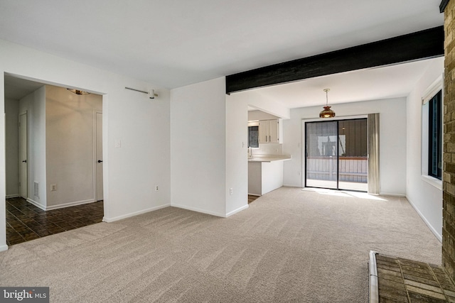 9103 Home Guard Dr, Burke, VA 22015 - unfurnished living room with carpet floors, beam ceiling, and baseboards