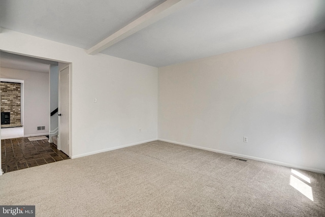 9103 Home Guard Dr, Burke, VA 22015 - carpeted spare room with beam ceiling, a fireplace, and baseboards