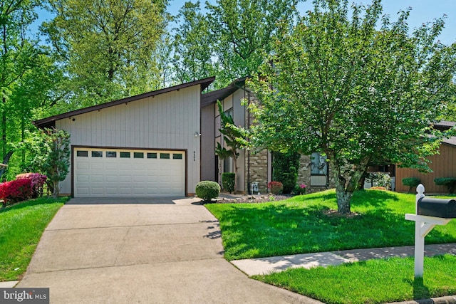 9103 Home Guard Dr, Burke, VA 22015 - mid-century modern home with driveway, a front lawn, and an attached garage