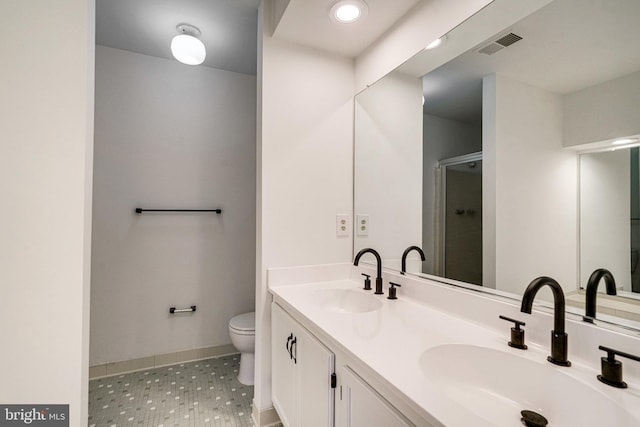 9103 Home Guard Dr, Burke, VA 22015 - bathroom with tile patterned floors, a stall shower, toilet, baseboards, and double vanity