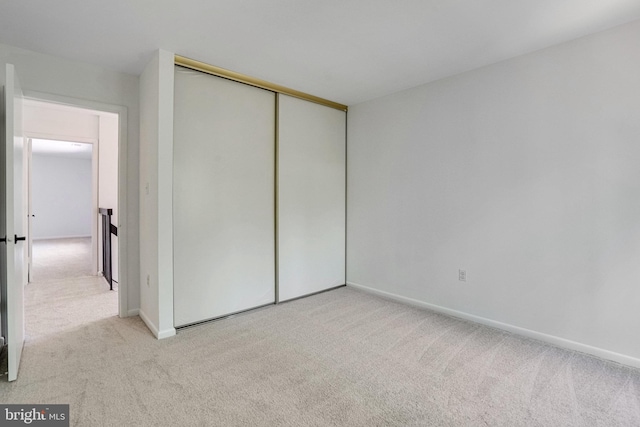 9103 Home Guard Dr, Burke, VA 22015 - unfurnished bedroom featuring carpet flooring, a closet, and baseboards